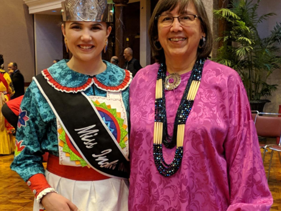 young girl beauty pageant winner with older woman